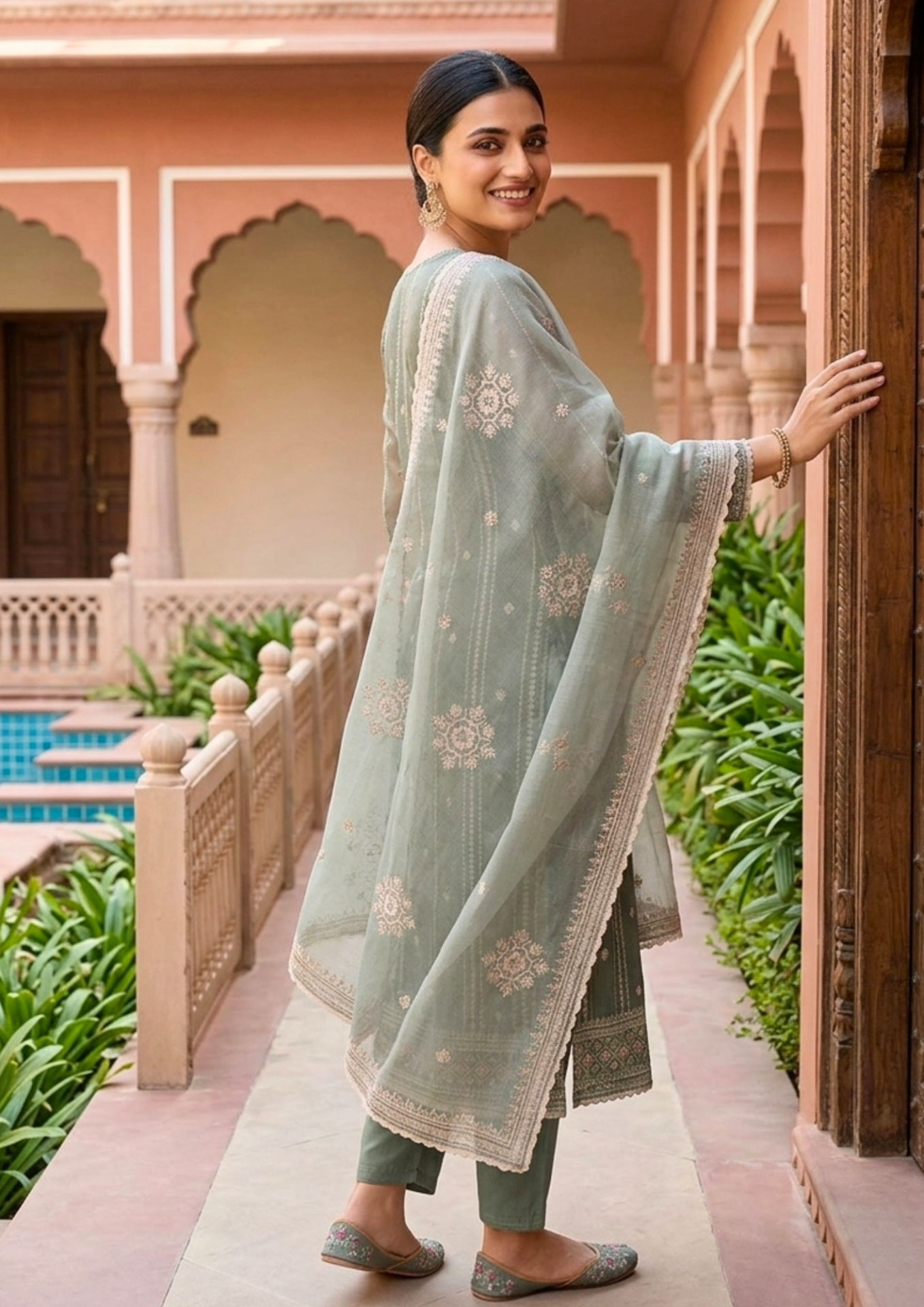 unstitched soft sage green organza with fine shimmer and intricate ivory threadwork suit material