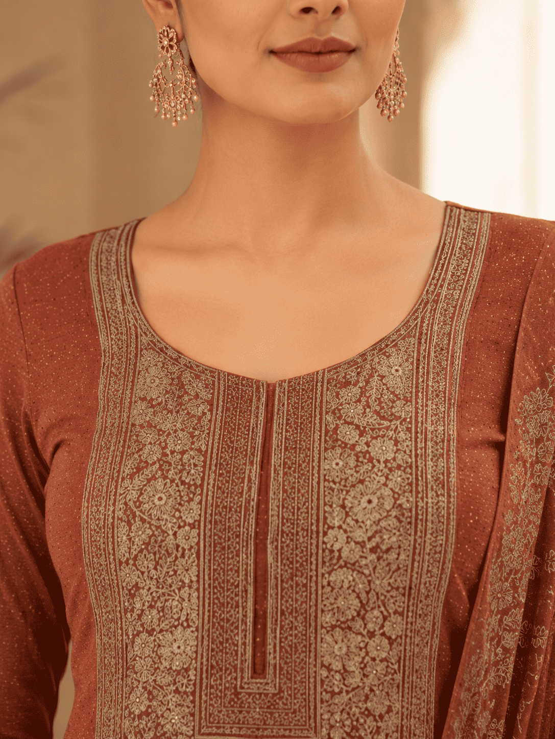 Semi-Stitched Deep Wine-Red Muslin Silk Suit Embellished With Scattered Rhinestone Butti And Intricate Golden Zari Embroidery