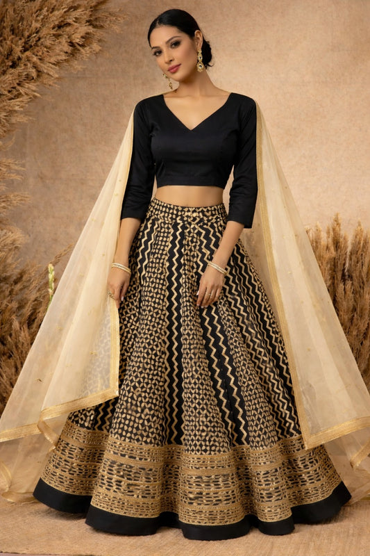 Black cotton silk blouse with ivory geometric printed gota lace lehenga paired with an ivory embroidered organza dupatta