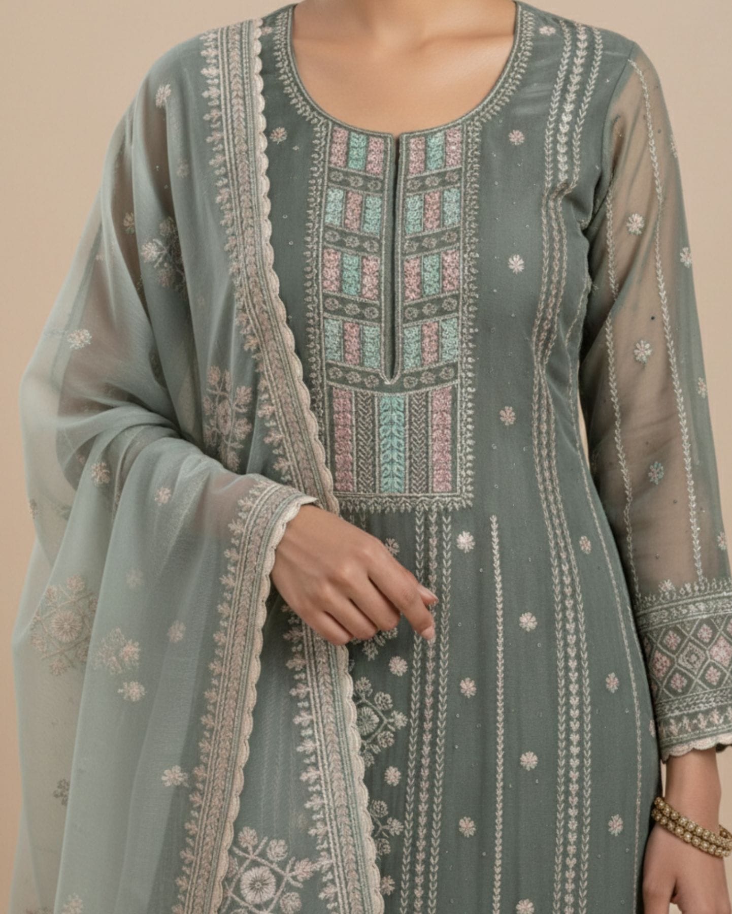 unstitched soft sage green organza with fine shimmer and intricate ivory threadwork suit material